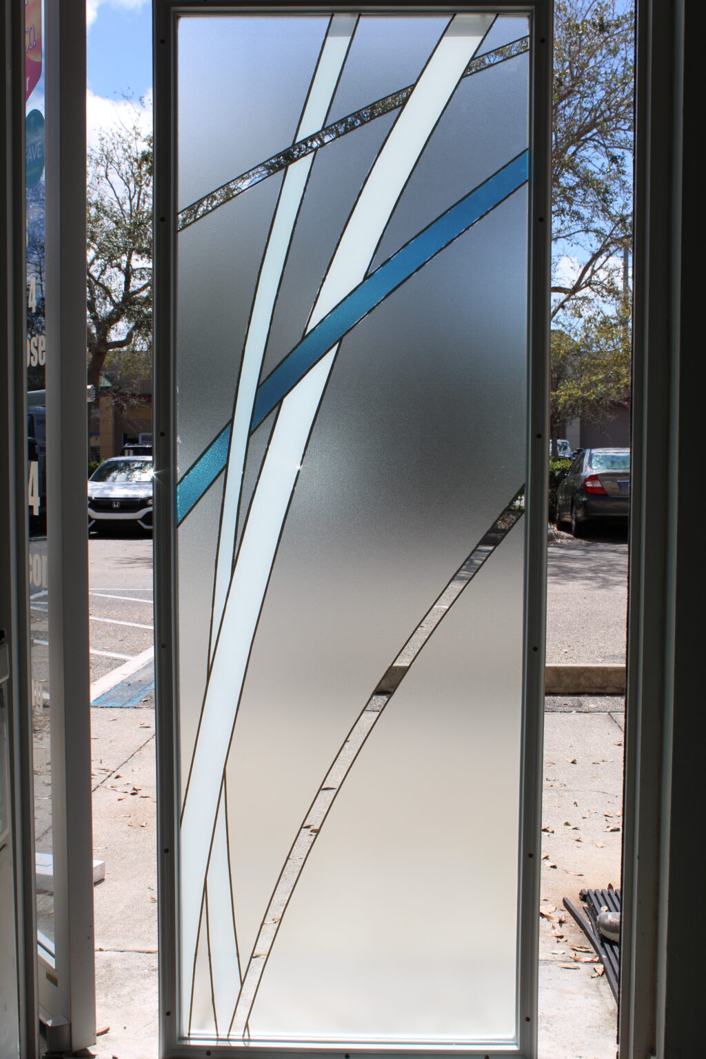 Elegant frosted glass film with intersecting white, blue, and textured clear curved accents
