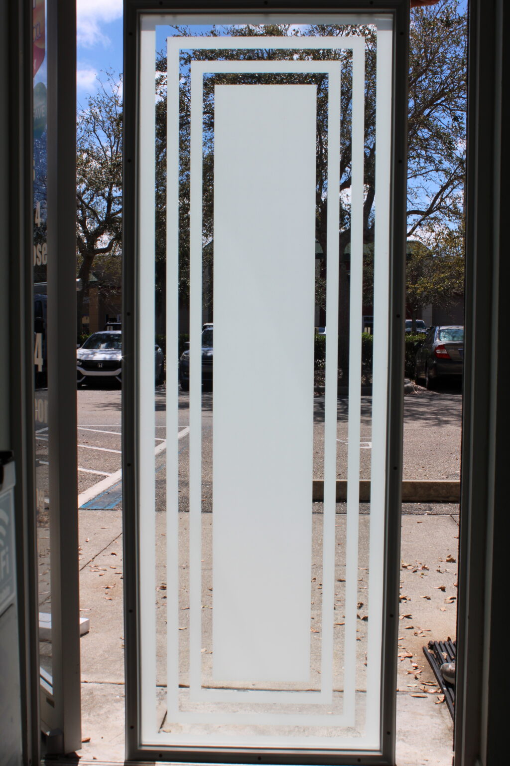 Frosted glass panel with geometric rectangular border design for a clean, modern look.